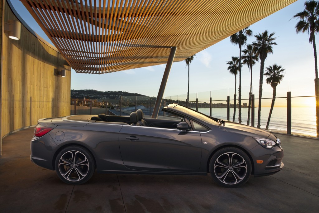 Buick Cascada Convertible, still side image with roof down. Vehicle is shown in Technical Grey exterior color, ebony leather interior and 20-inch wheels.